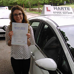 Young woman holding test certificate in Chesterfield