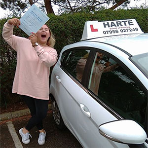 Very happy young woman in chesterfield