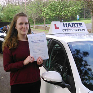 Woman holding driving test pass certificate chesterfield